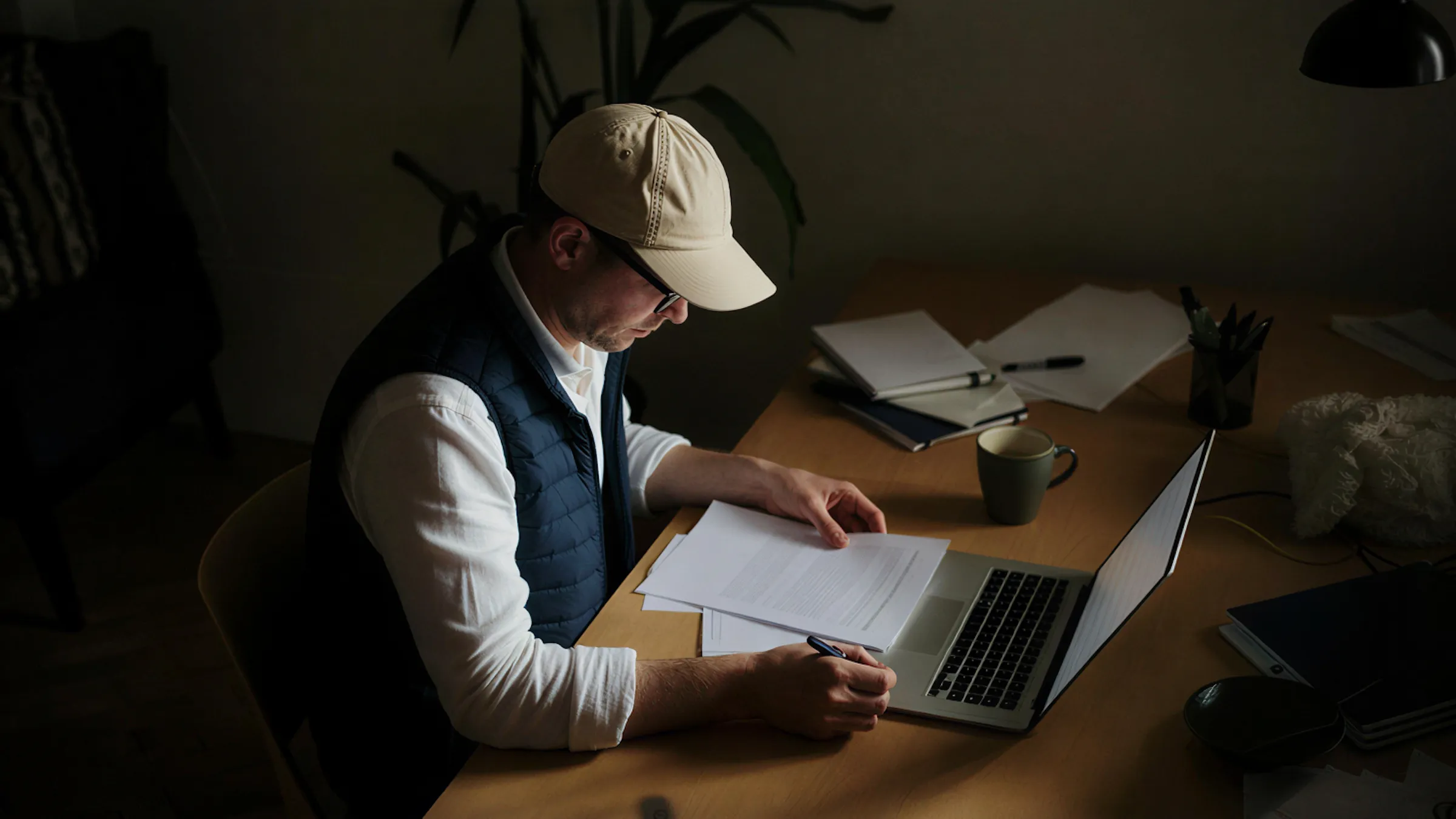 Business owner reviewing finances on a laptop
